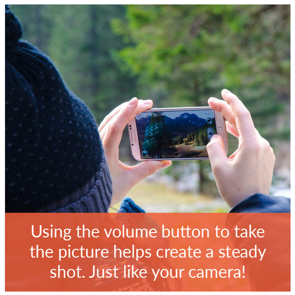 Turn the phone sideways and use the volume buttons to shoot the picture