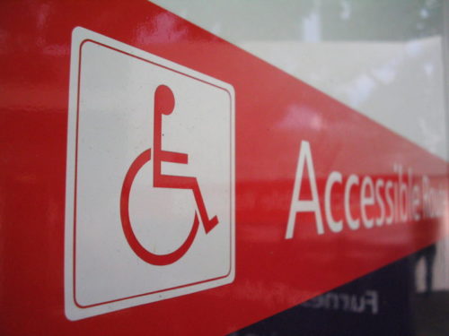 A handicapped sign and icon marking an accessible route